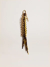 Charm with yellow and brown knotted hiking laces with chain