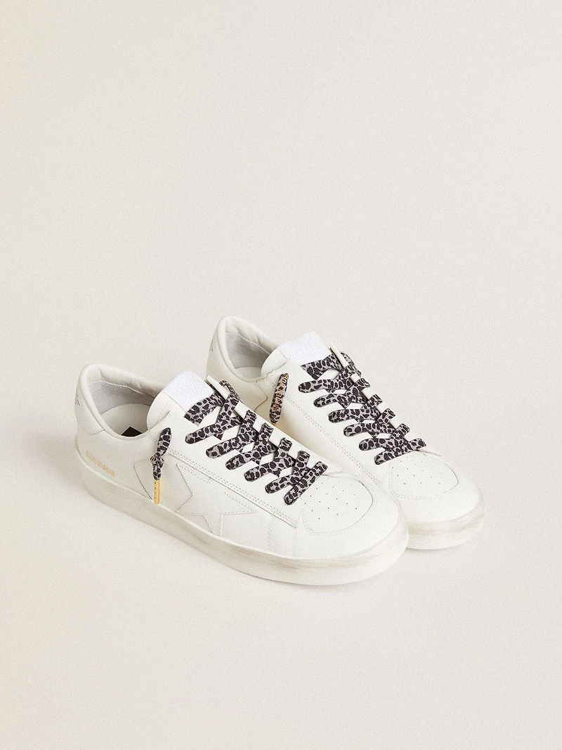 Gray and black animal-print laces with contrasting gold logo