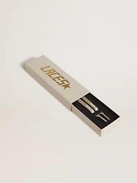 Gold-colored Lurex laces with contrasting white logo