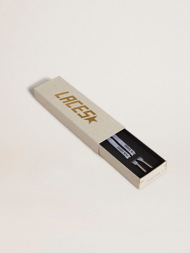 Silver-colored Lurex laces with contrasting black logo