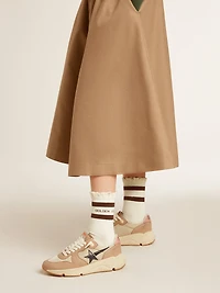 Worn-white socks with distressed details and brown stripes