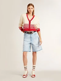 Worn-white socks with distressed details and brown stripes