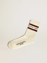 Worn-white socks with distressed details and brown stripes