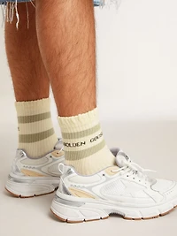 White socks with distressed details and gray stripes