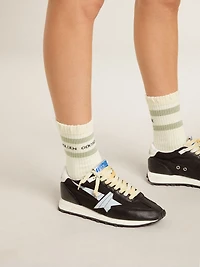 White socks with distressed details and gray stripes