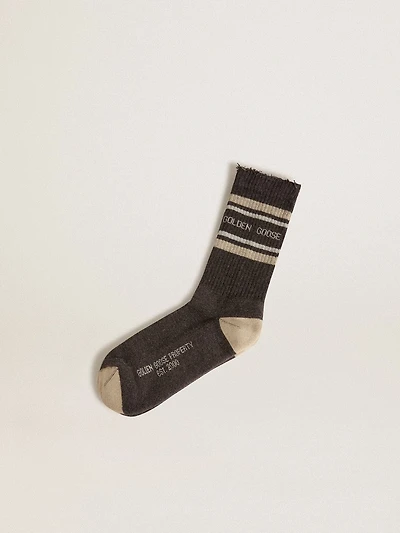 Dark grey socks with distressed details and cream worn-white stripes