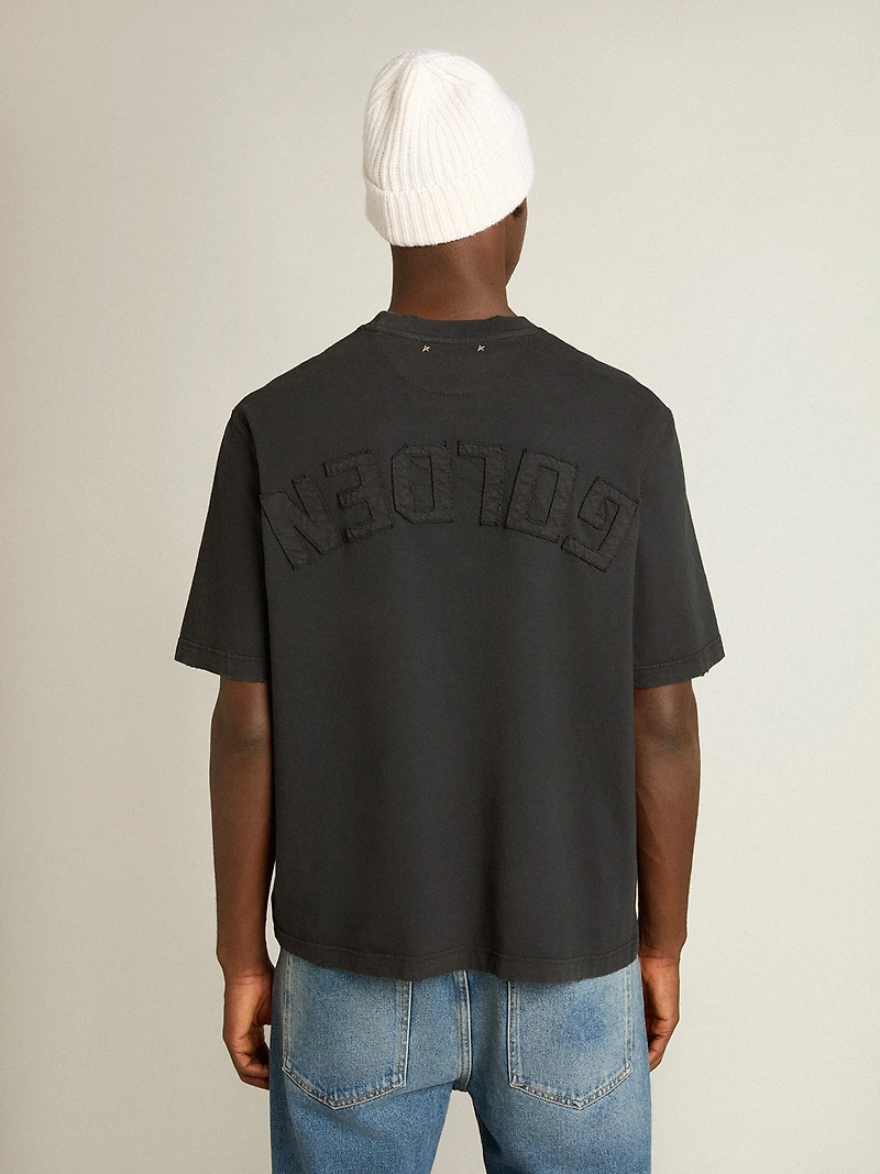 T-shirt washed black with reverse logo on the back