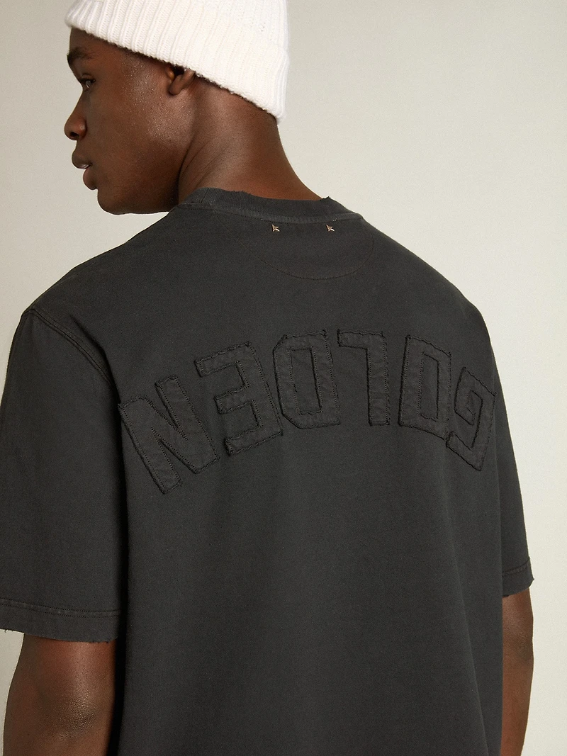 T-shirt washed black with reverse logo on the back