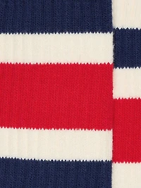 Worn-white socks with blue and red stripes