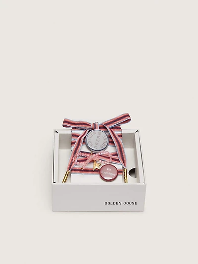 Skins "Playful" colored striped laces with charm and pins