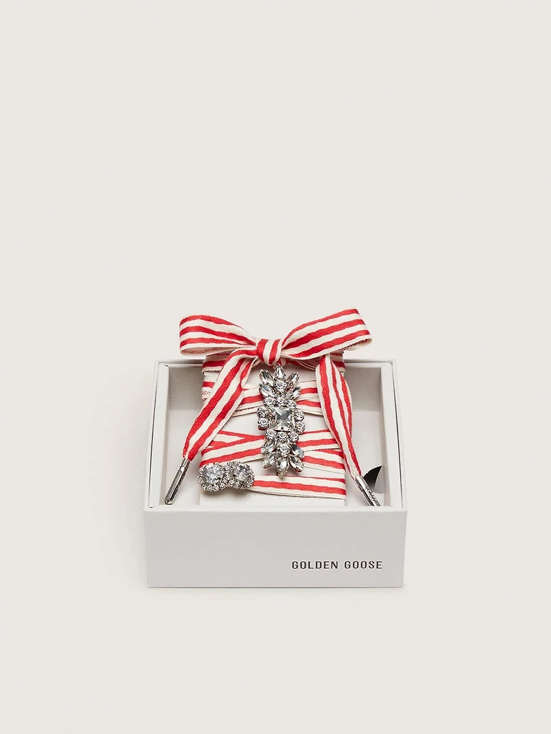 Skins "Playful" red and beige striped laces embellished with two charms