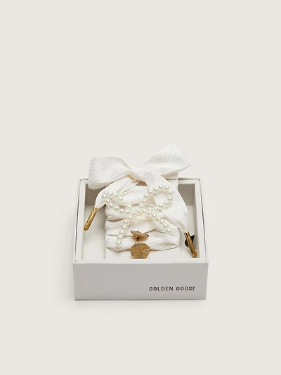 Skins "Sparkling" cream striped laces embellished with beaded charm and golden charm