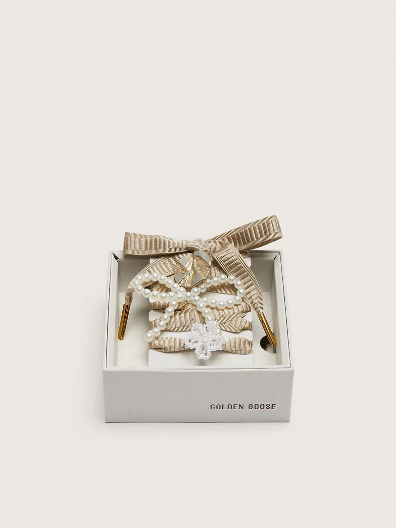 Skin "Sparkling" beige embroidered laces with appliqué beaded charms and gold charm