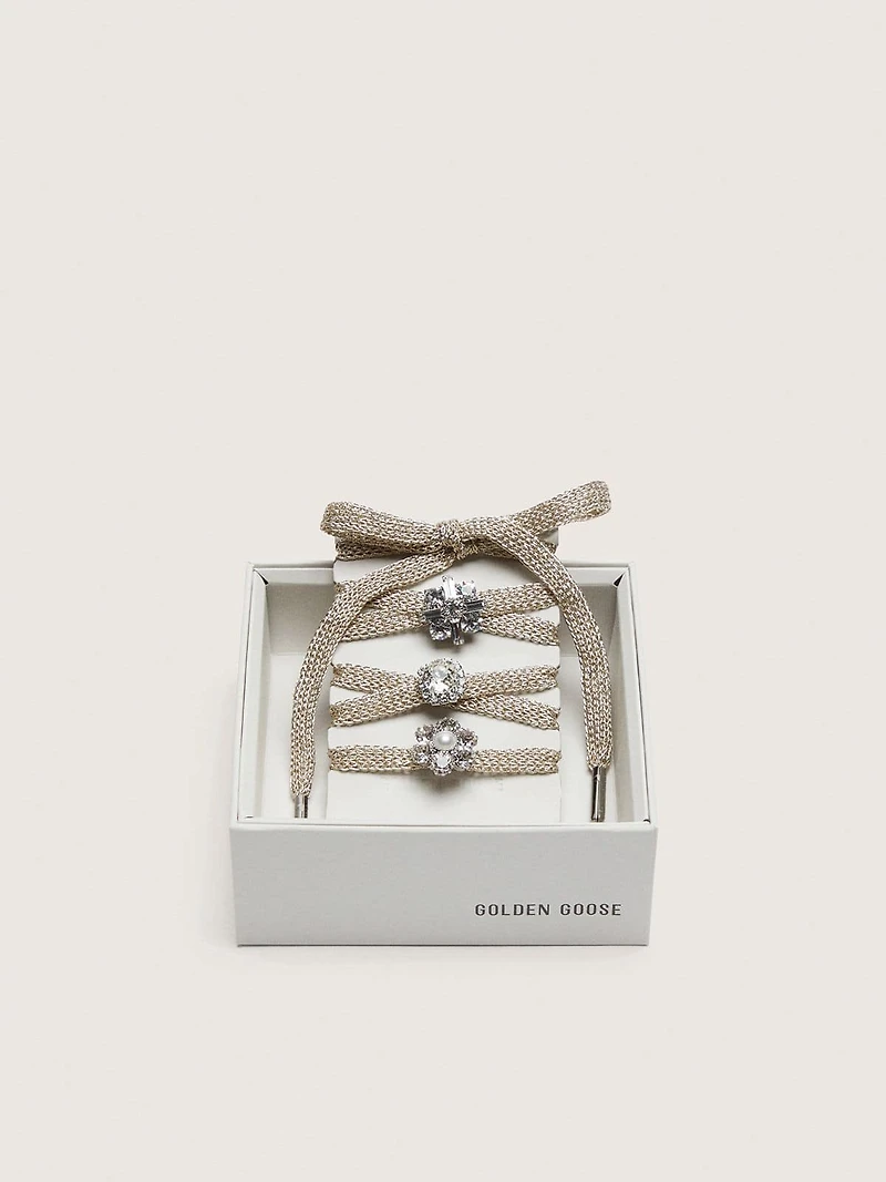 Skins "Sparkling" braided gold-colored laces with shimmering charms