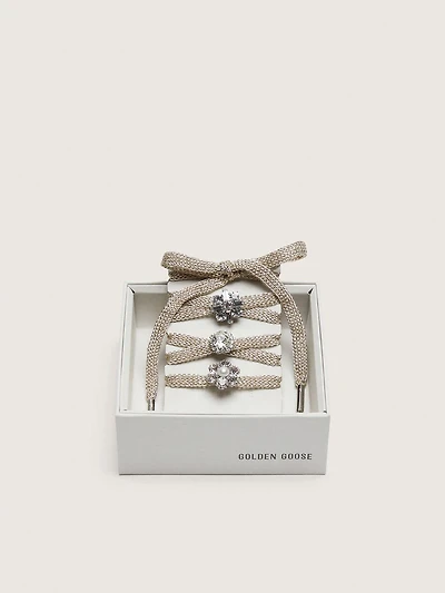 Skins "Sparkling" braided gold-colored laces with shimmering charms
