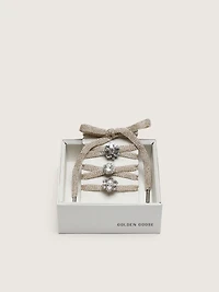 Skins "Sparkling" braided gold-colored laces with shimmering charms