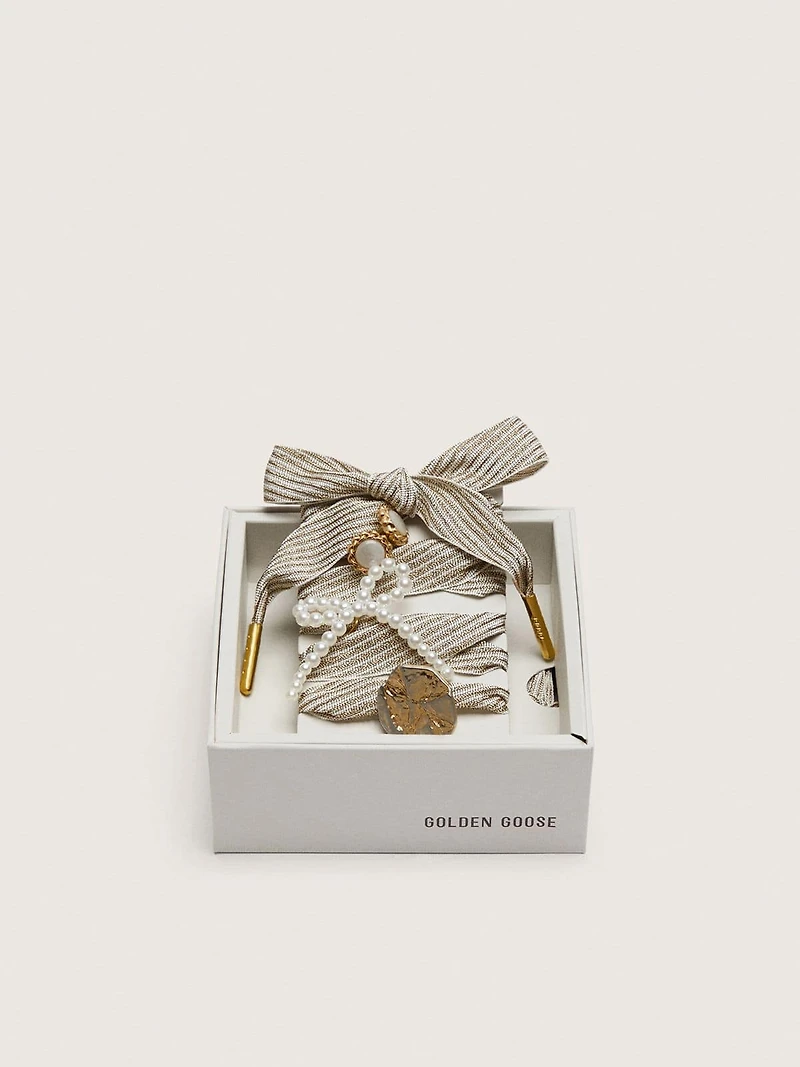 Skins "Sparkling" white and gold striped laces embellished with charms