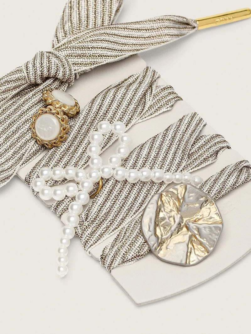 Skins "Sparkling" white and gold striped laces embellished with charms