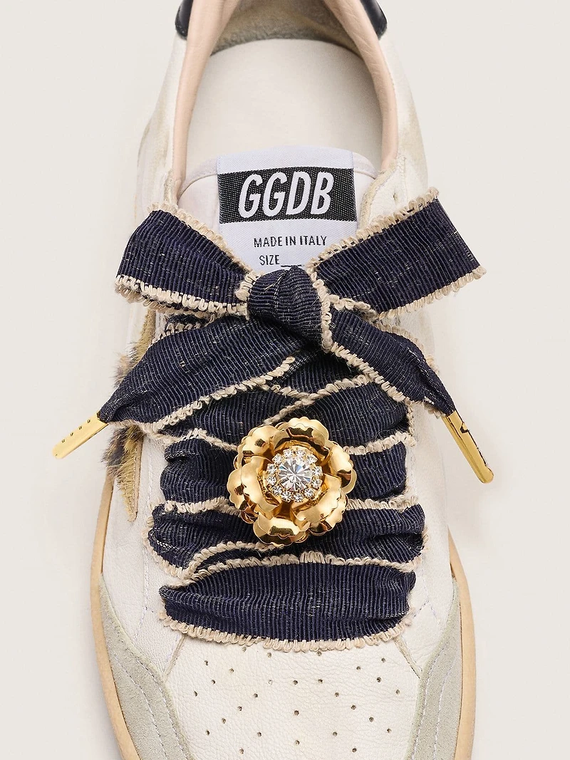 Skins "Sparkling" denim blue laces embellished with beige trim and a golden charm