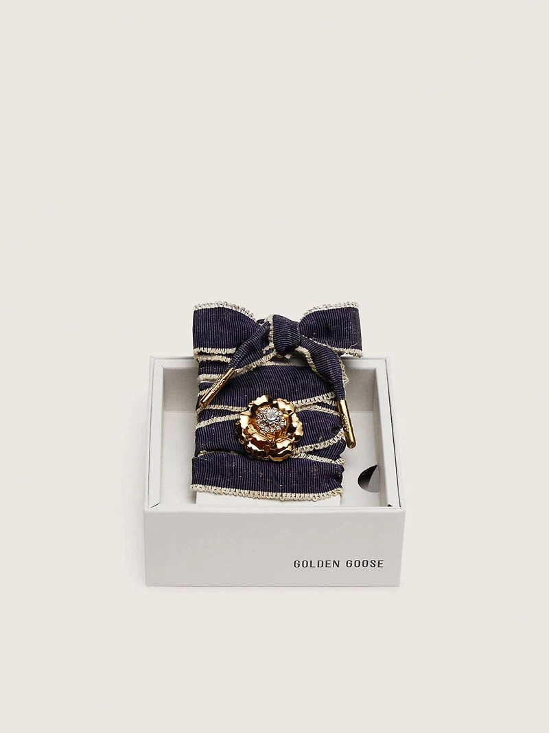 Skins "Sparkling" denim blue laces embellished with beige trim and a golden charm