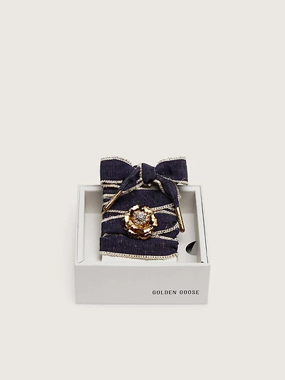 Skins "Sparkling" denim blue laces embellished with beige trim and a golden charm