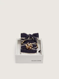 Skins "Sparkling" denim blue laces embellished with beige trim and a golden charm