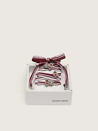 Skins white and burgundy striped laces embellished with charms
