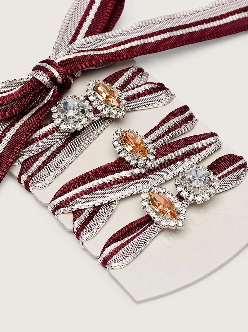 Skins white and burgundy striped laces embellished with charms