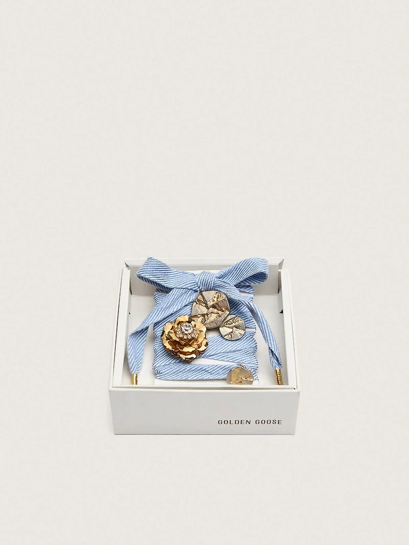 Skins light blue and white herringbone laces embellished with charms