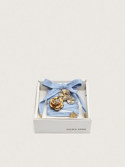 Skins light blue and white herringbone laces embellished with charms