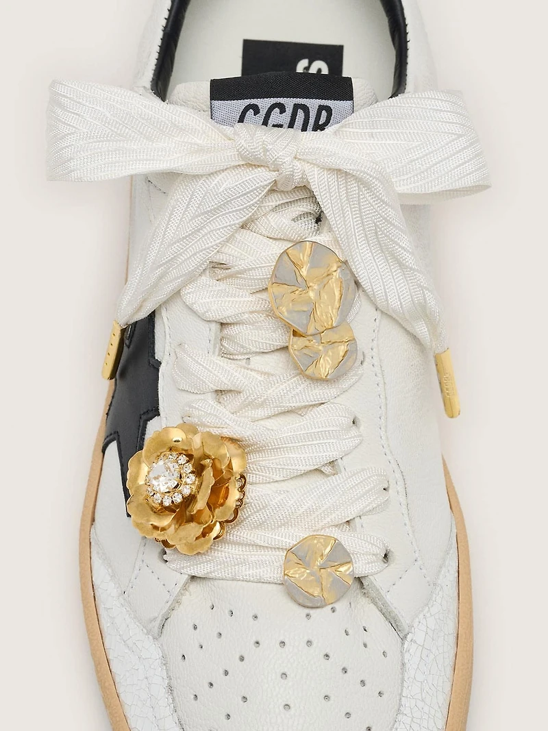 Skins cream herringbone laces embellished with charms