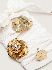 Skins cream herringbone laces embellished with charms