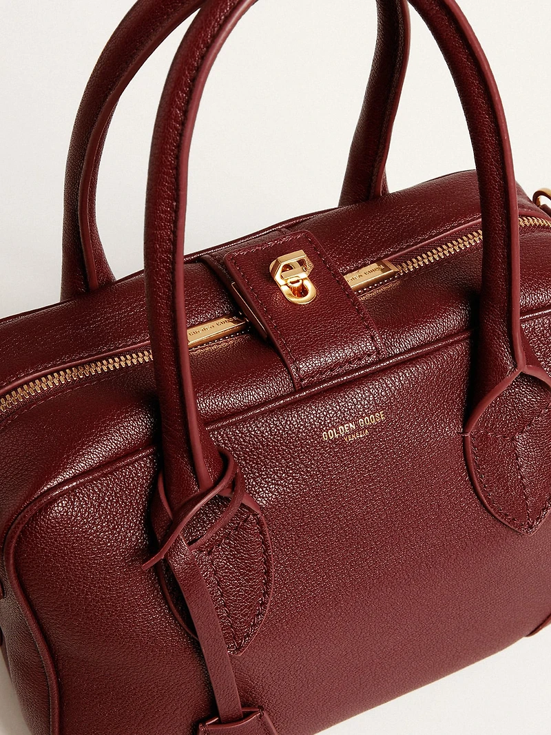 Vita Bag in burgundy leather with gold details