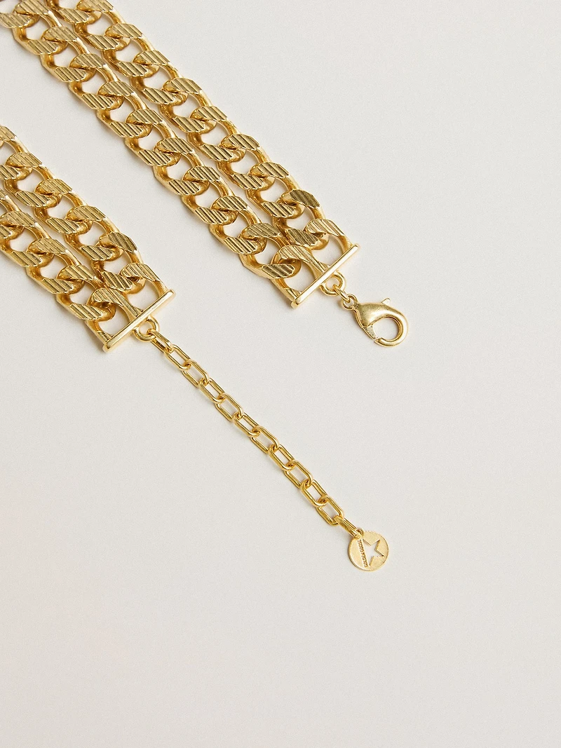 Antique gold-colored braided chain necklace with star-shaped clasp
