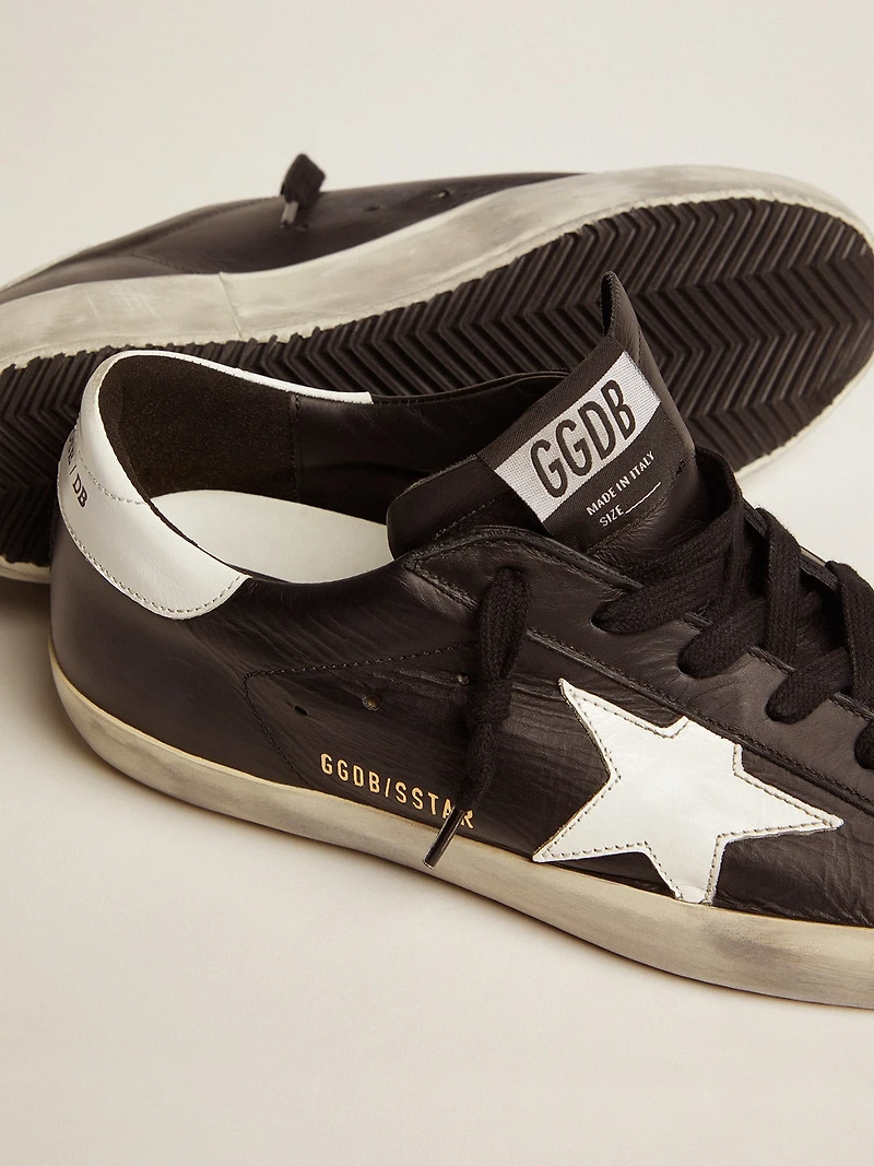 Women’s Super-Star black leather with white star and heel tab