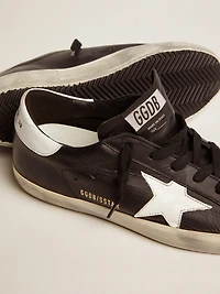 Women’s Super-Star black leather with white star and heel tab