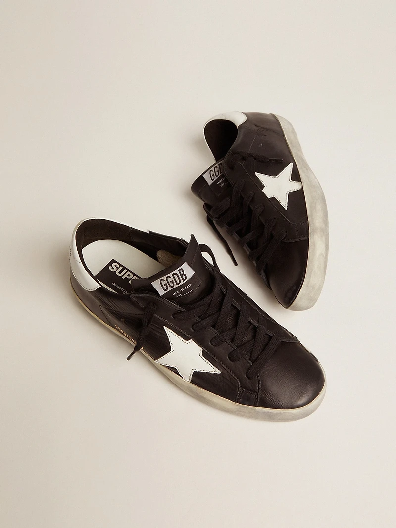 Women’s Super-Star black leather with white star and heel tab