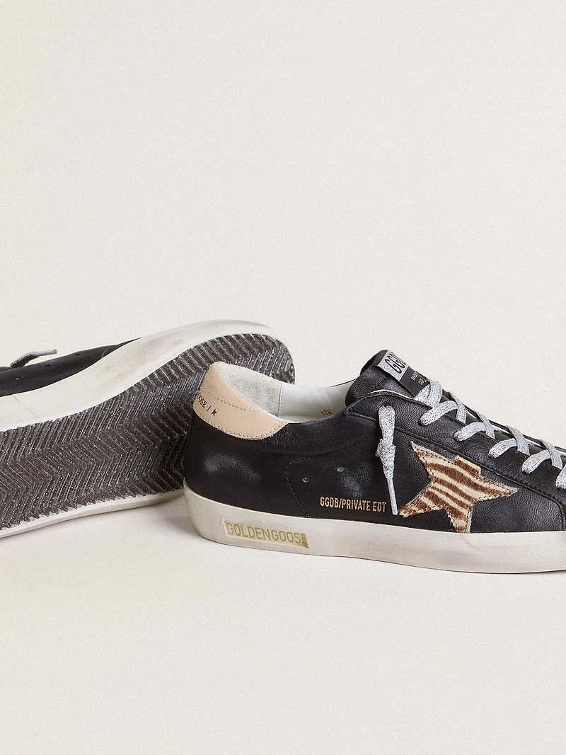 Women’s Super-Star black nappa leather with zebra-print pony skin star and beige heel tab