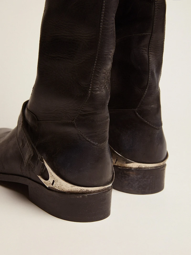 Women's black leather boots with clamp on the heel
