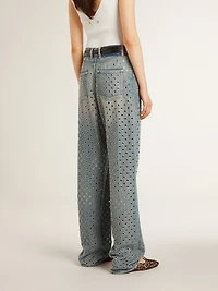 Women's washed jeans with all-over eyelets