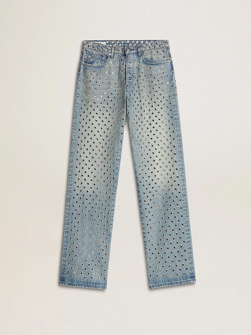 Women's washed jeans with all-over eyelets