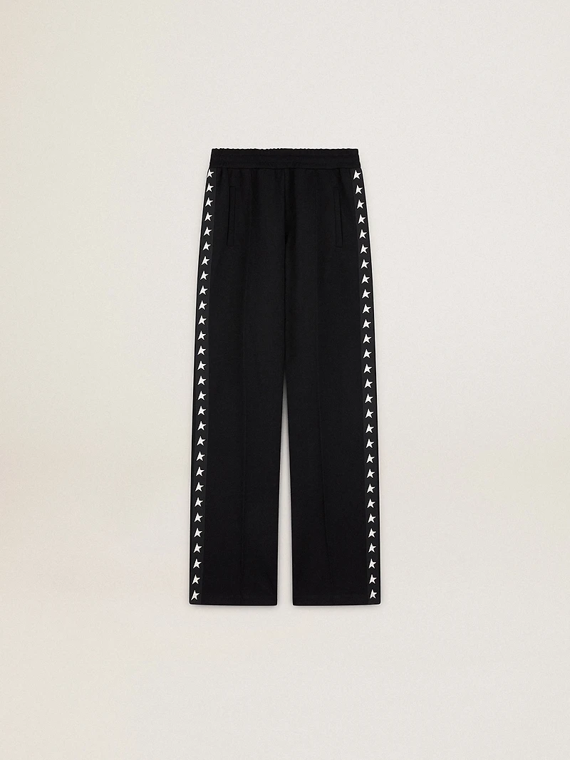 Women’s black joggers with white stars on the sides