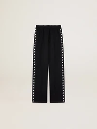 Women’s black joggers with white stars on the sides