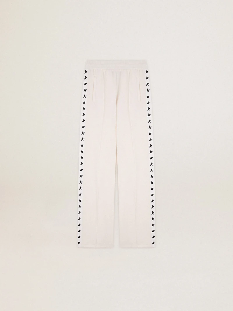 Women’s white joggers with stars on the sides