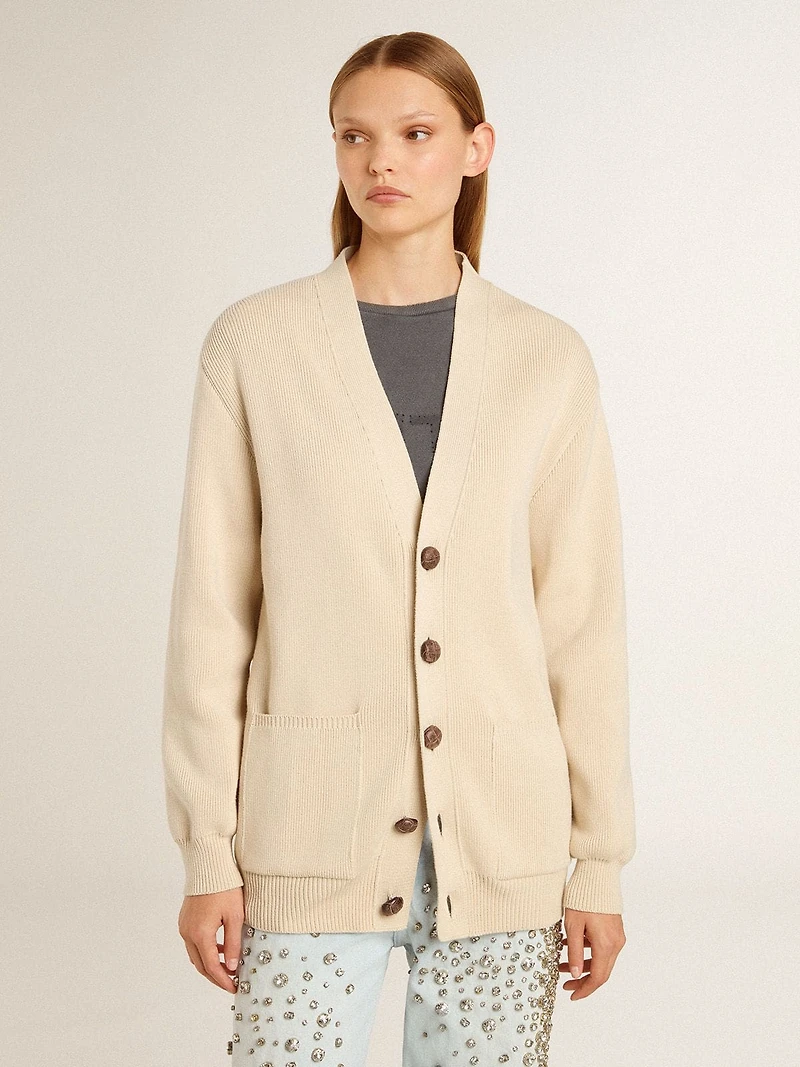 Women’s beige cardigan with 'Golden' lettering on the back