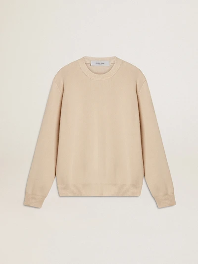 Women's beige sweater with 'Golden' lettering on the back
