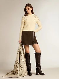 Women's cropped worn-white sweater with decorative crystals