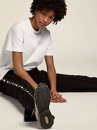 Women's white T-shirt with silver glitter logo and star