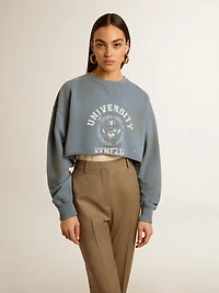 Cropped sweatshirt in baby blue with distressed finish