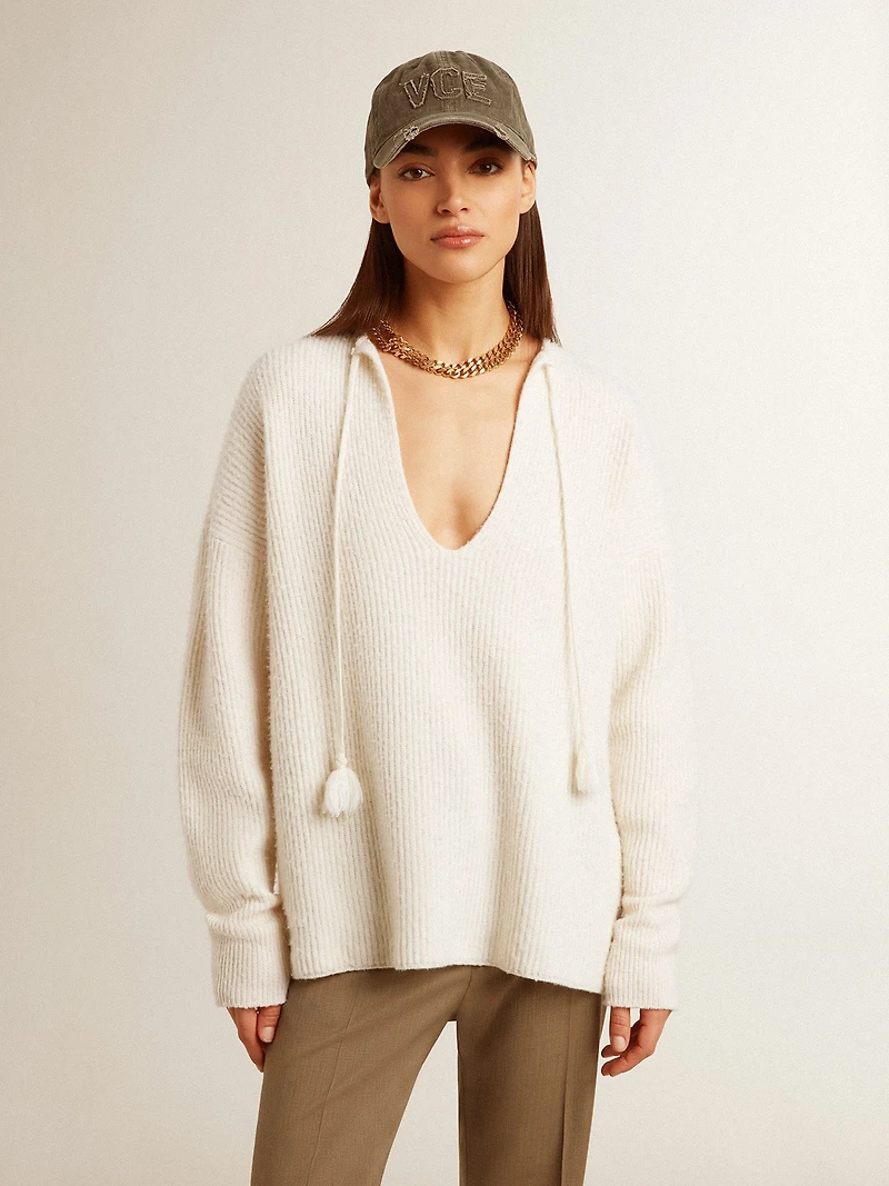 Ribbed wool sweater with V neck and drawstring tassels